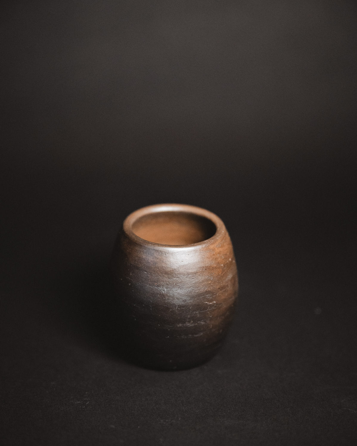Oaxacan Black Clay mezcal copita on black background