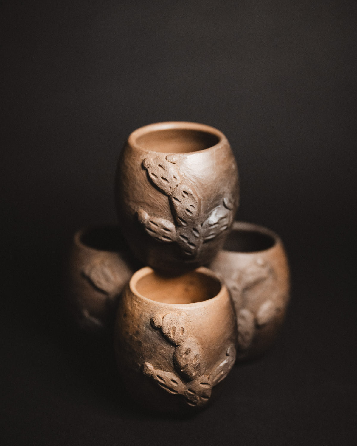 Oaxacan Black Clay mezcal copitas on black background