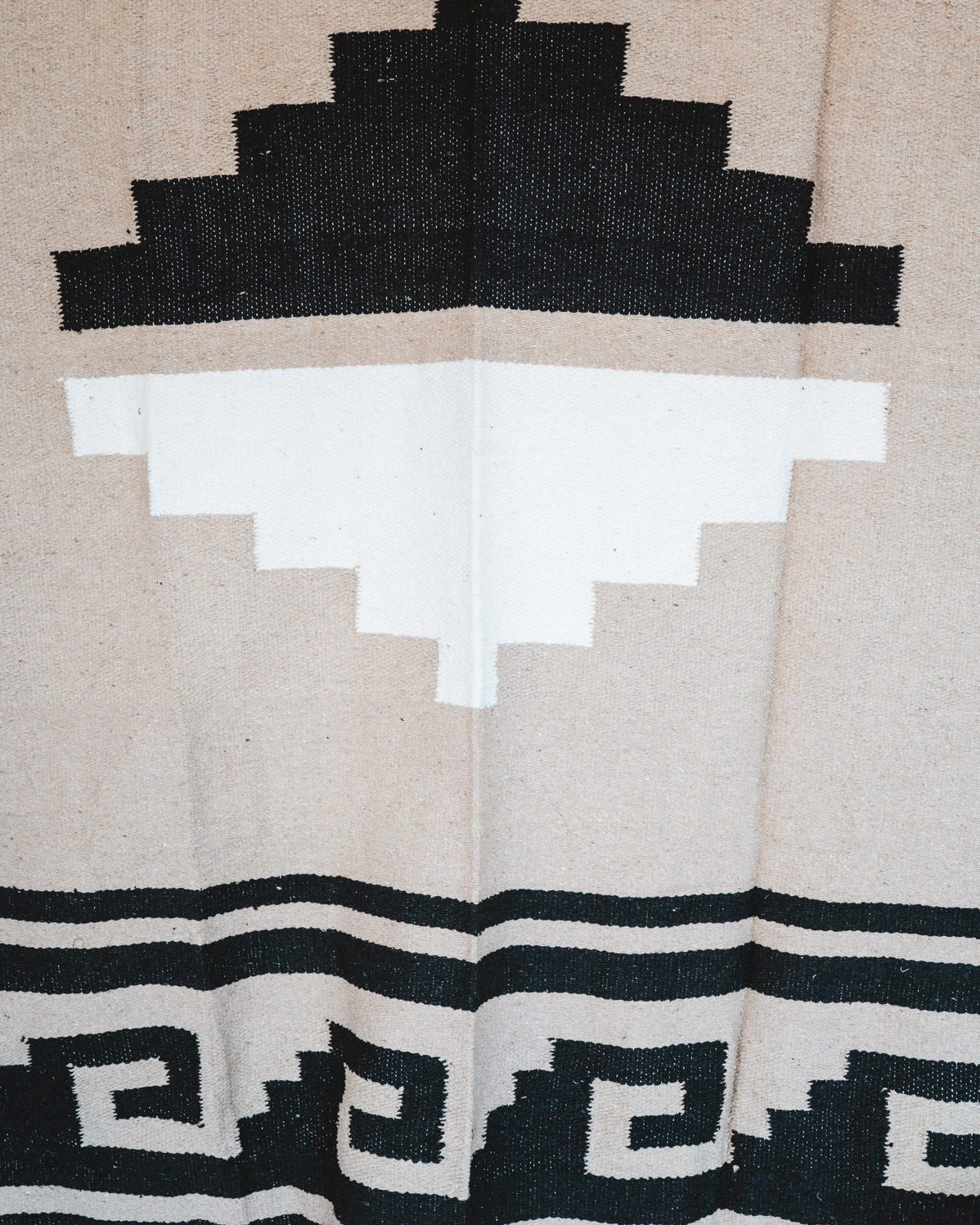Handwoven Mexican Blanket beige Mixteca Greca  pattern in modern industrial setting