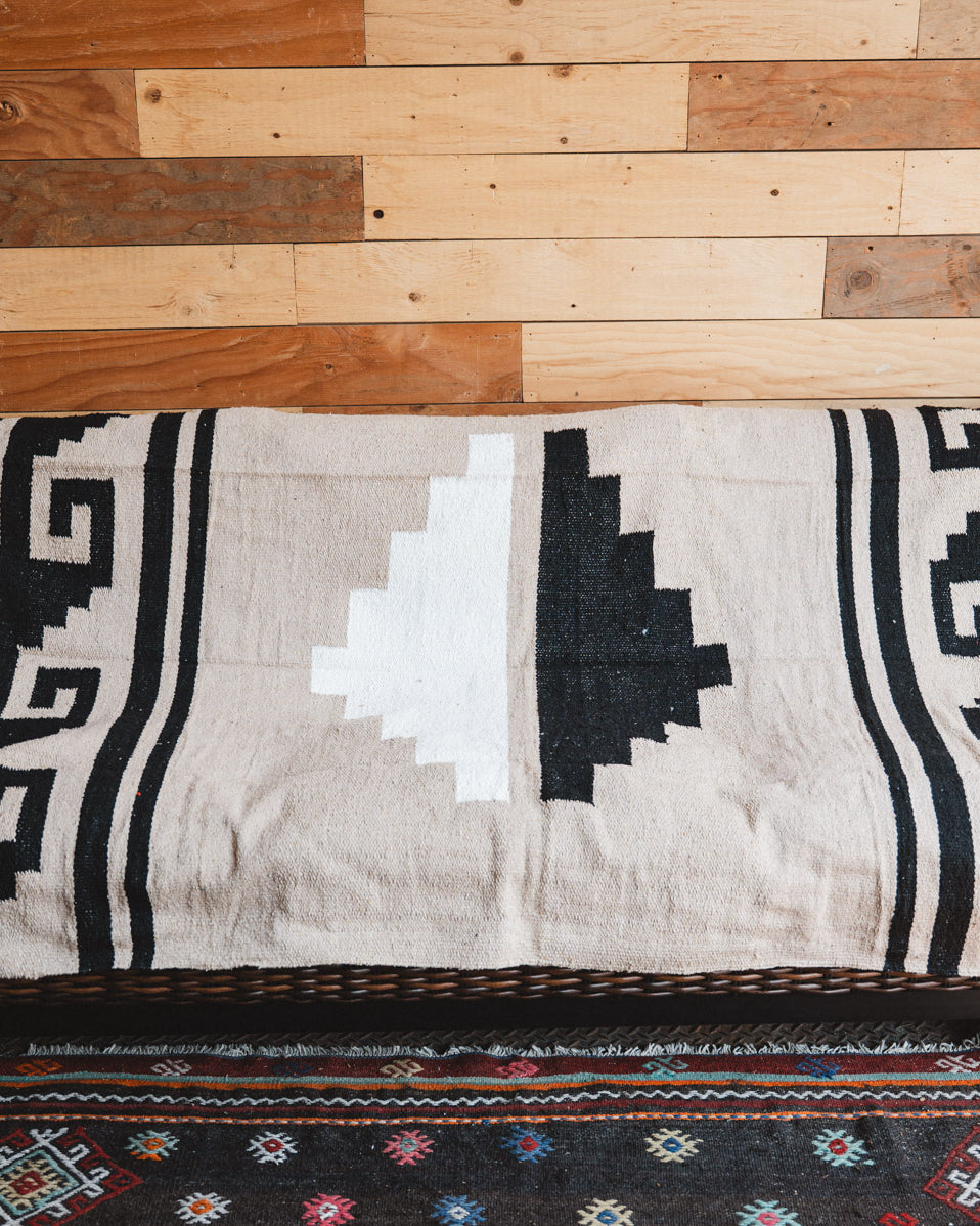 Handwoven Mexican Blanket beige Mixteca Greca  pattern in modern industrial setting
