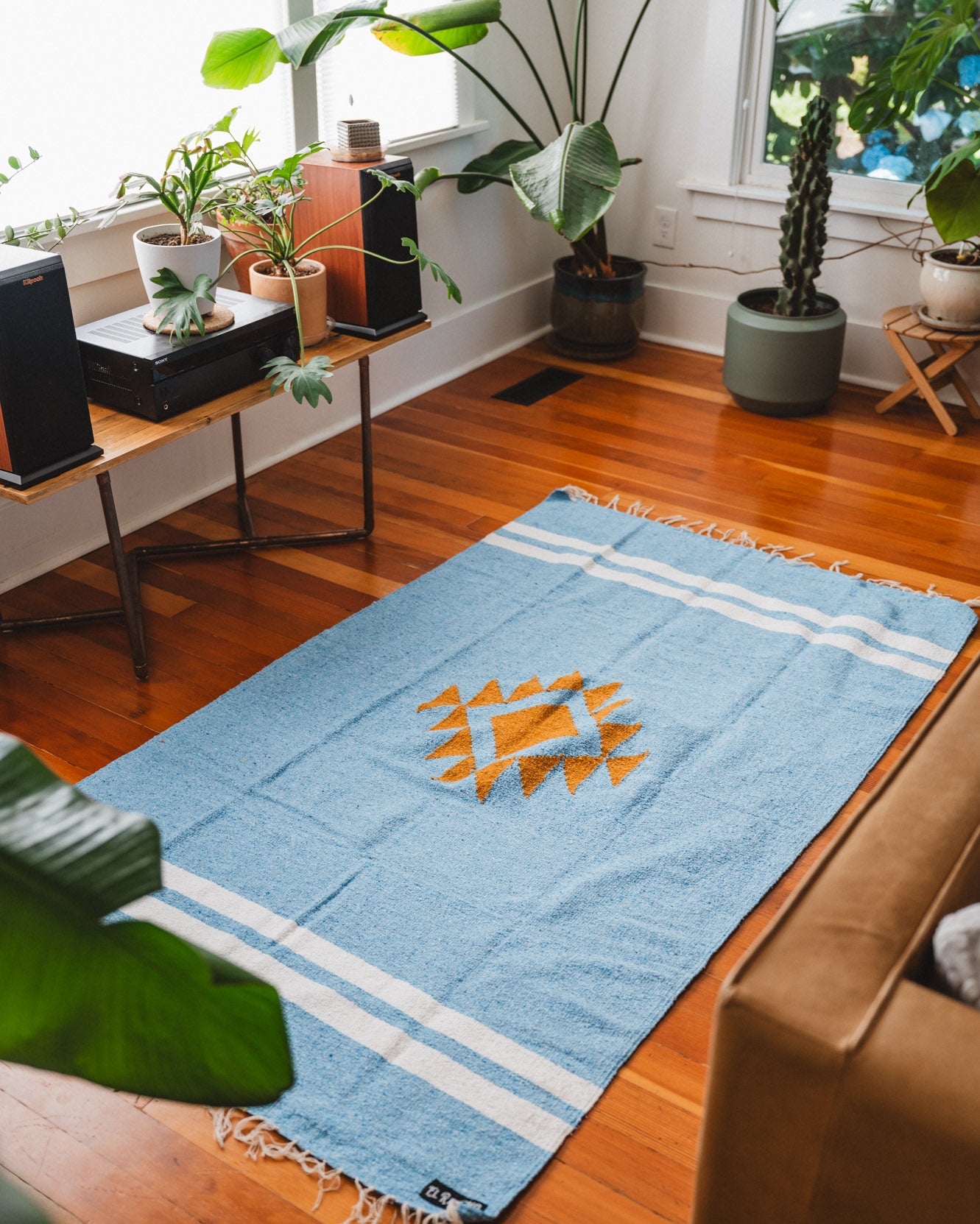 Blue and gold diamond blanket on the floor