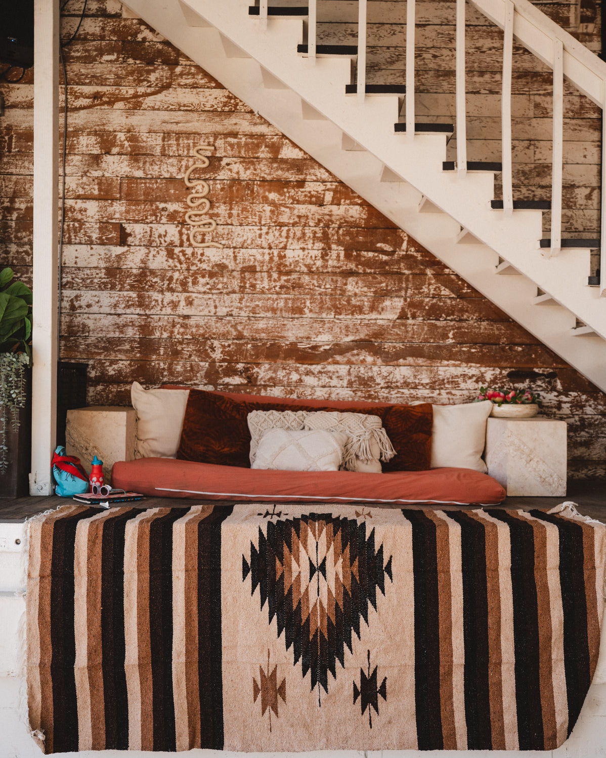 Brown beige and neutral colored handwoven Mexican blanket in urban loft setting