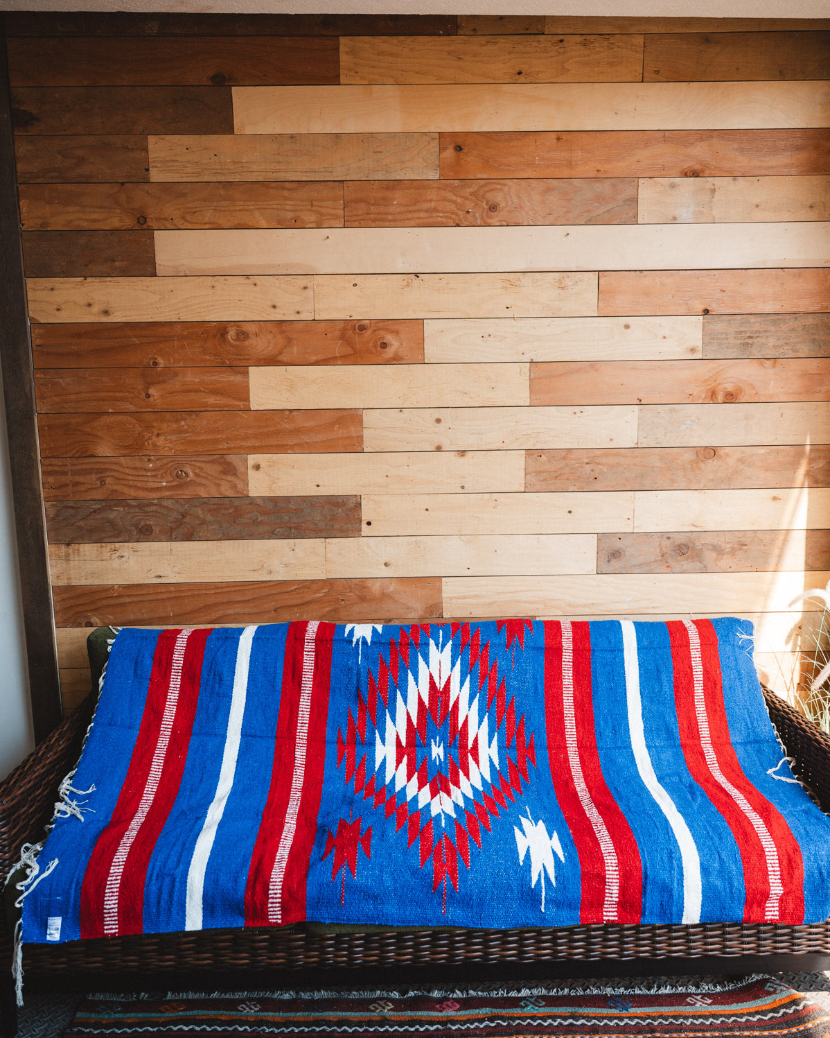 Handwoven Mexican Blanket Buffalo USA color Diamond pattern in modern industrial setting