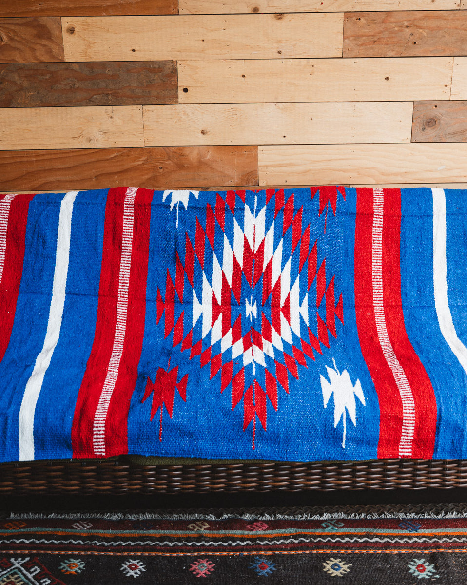 Handwoven Mexican Blanket Buffalo USA color Diamond pattern in modern industrial setting