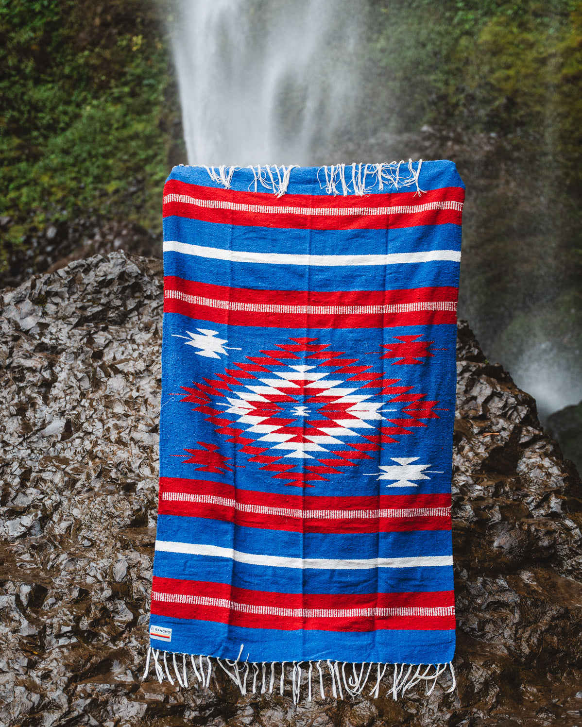 Buffalo NY colored diamond mexican blanket in a forest background