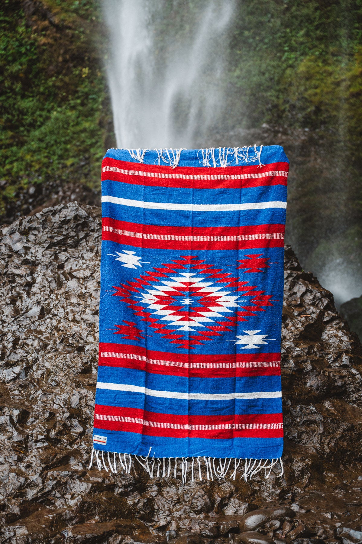 Buffalo NY colored diamond mexican blanket in a forest background