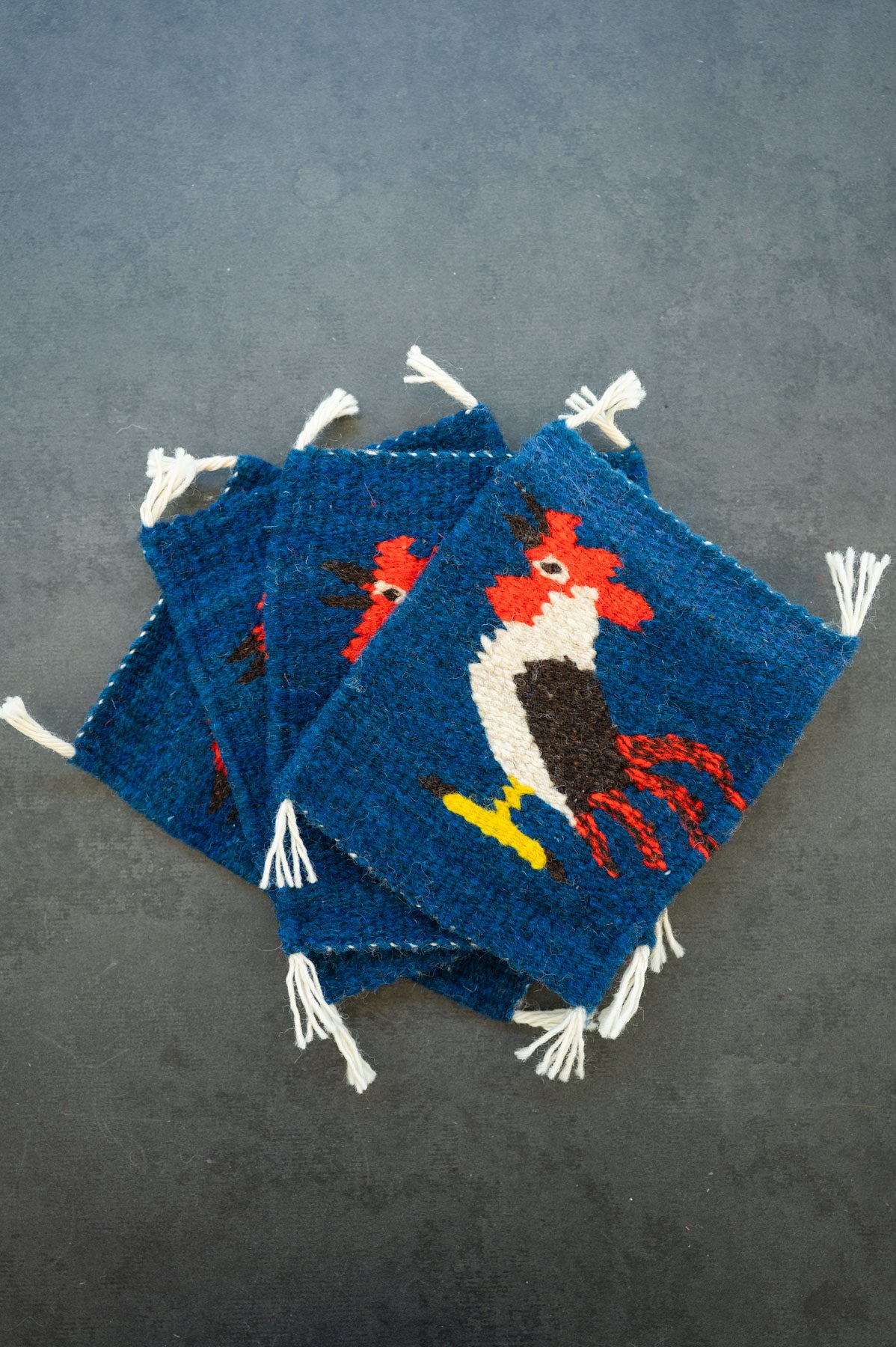 Handwoven wool coaster from Teotitlan Del Valle of an rooster