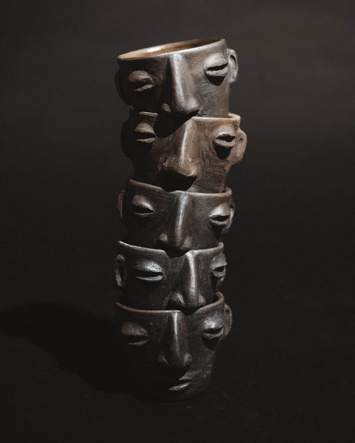 Handmade barro negro clay carita mezcalero cups from Oaxaca