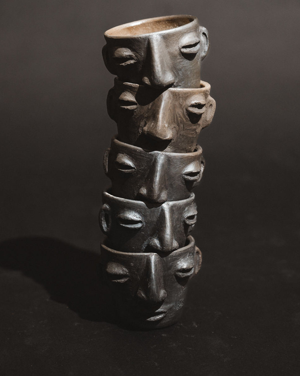 Handmade barro negro clay carita mezcalero cups from Oaxaca