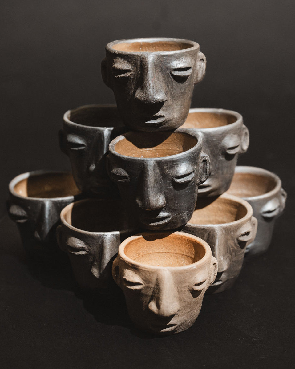 Handmade barro negro clay carita mezcalero cups from Oaxaca