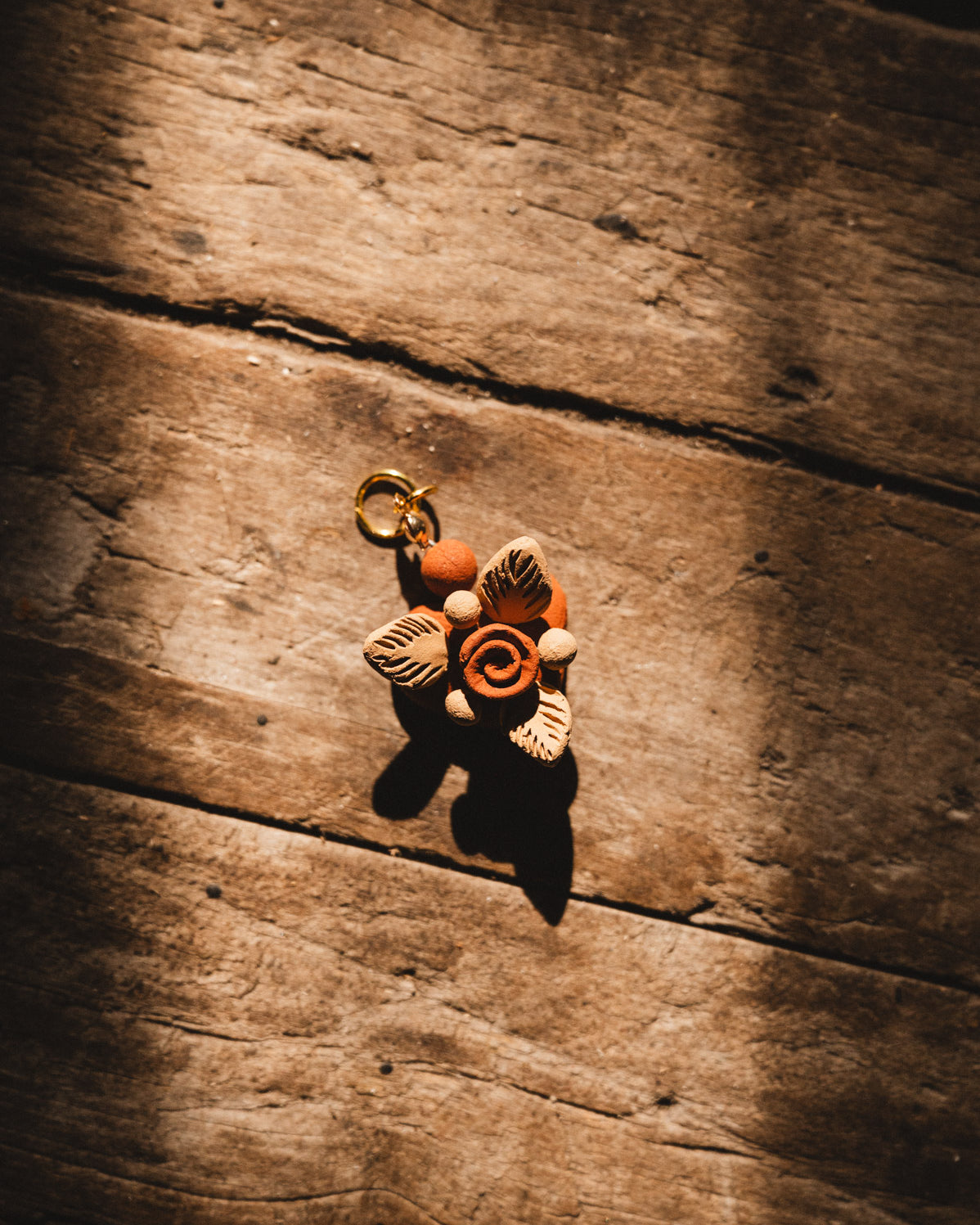 Filigrana Heart Pendant on wooden floor