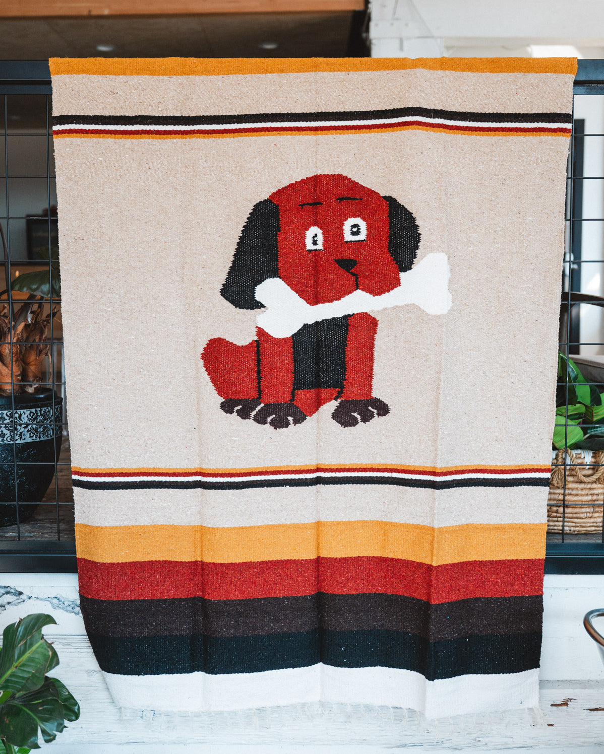 Handwoven Mexican Dog blanket in modern industrial setting