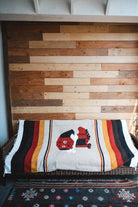 Handwoven Mexican Dog blanket in modern industrial setting