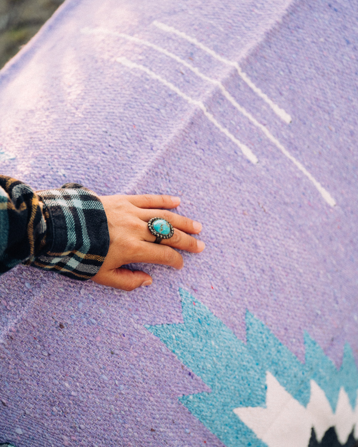 Turquoise Ring on lavender hadnwoven zapotec mexican blanket