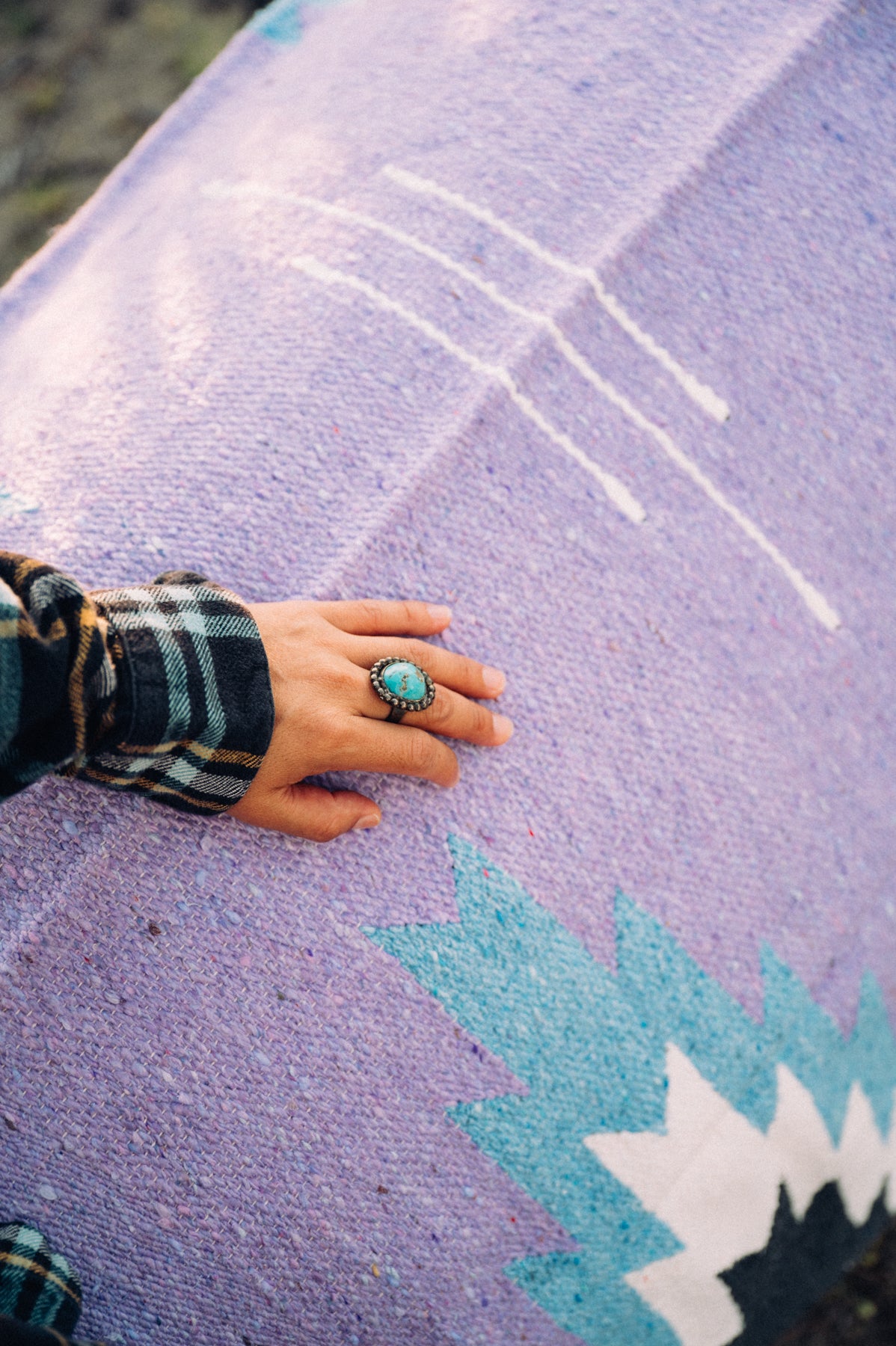 Turquoise Ring on lavender hadnwoven zapotec mexican blanket