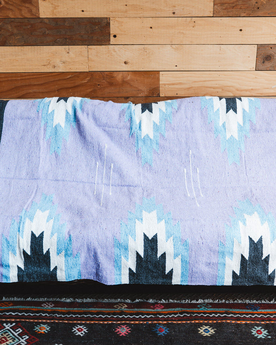 Handwoven Mexican Blanket Lavender Relampago pattern in modern industrial setting