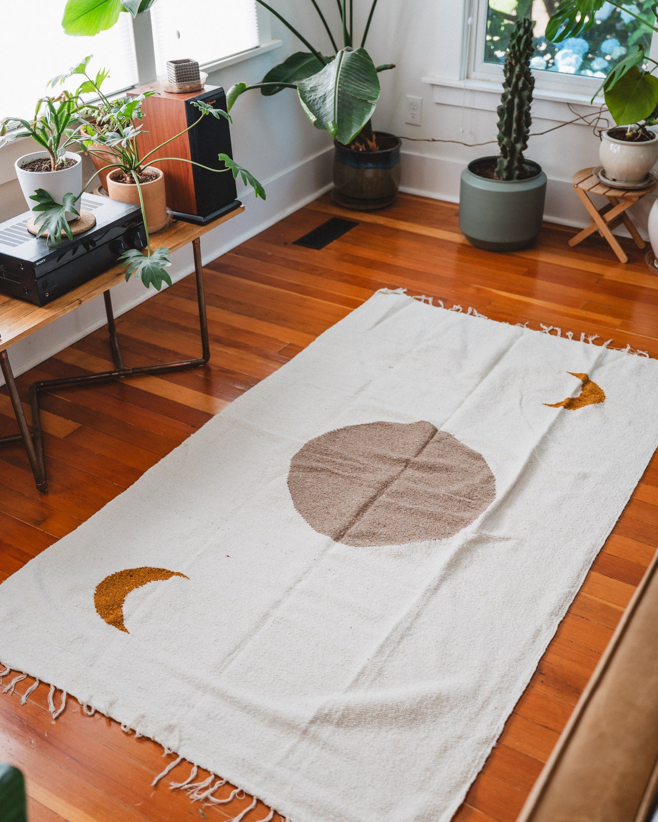 Cream solar lunar blanket on floor