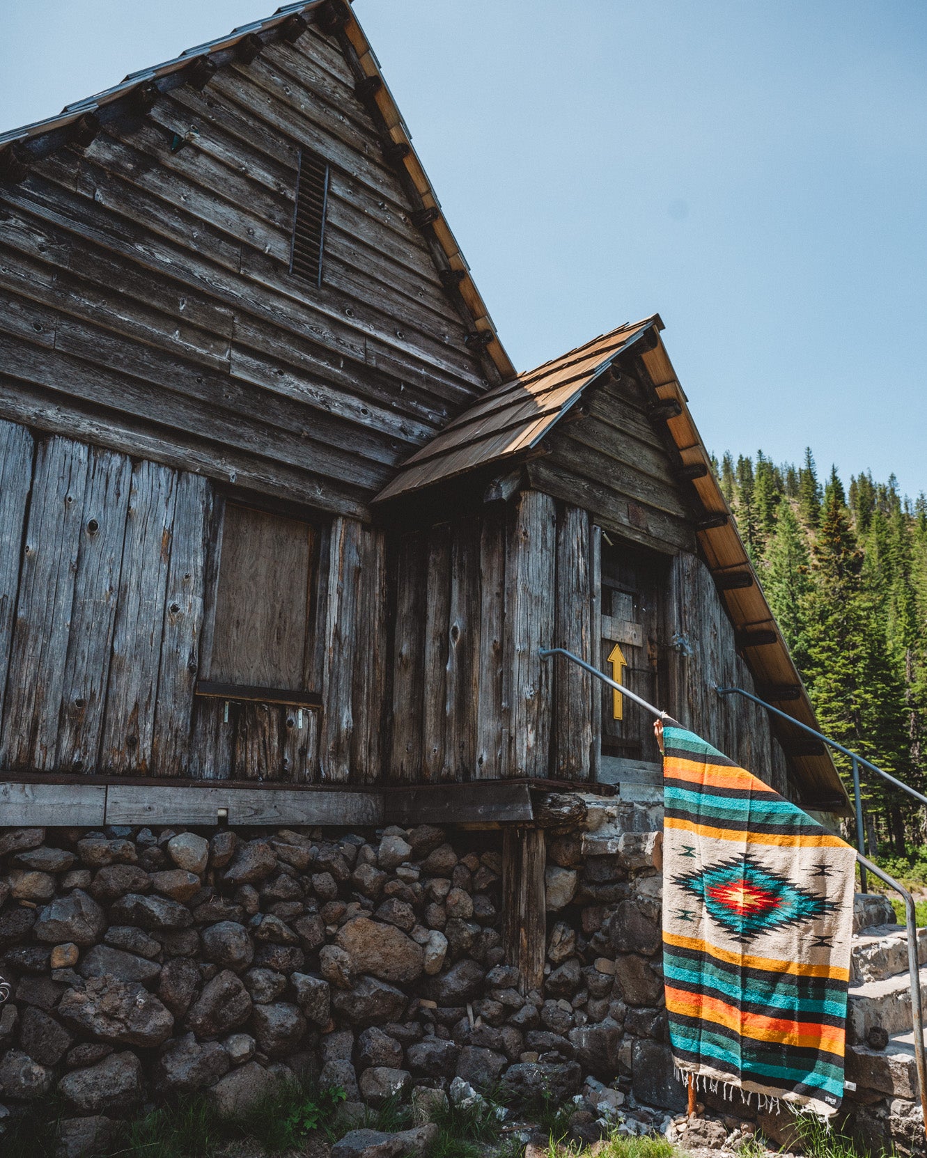 Diamond blanket in front of cabin on the mountain