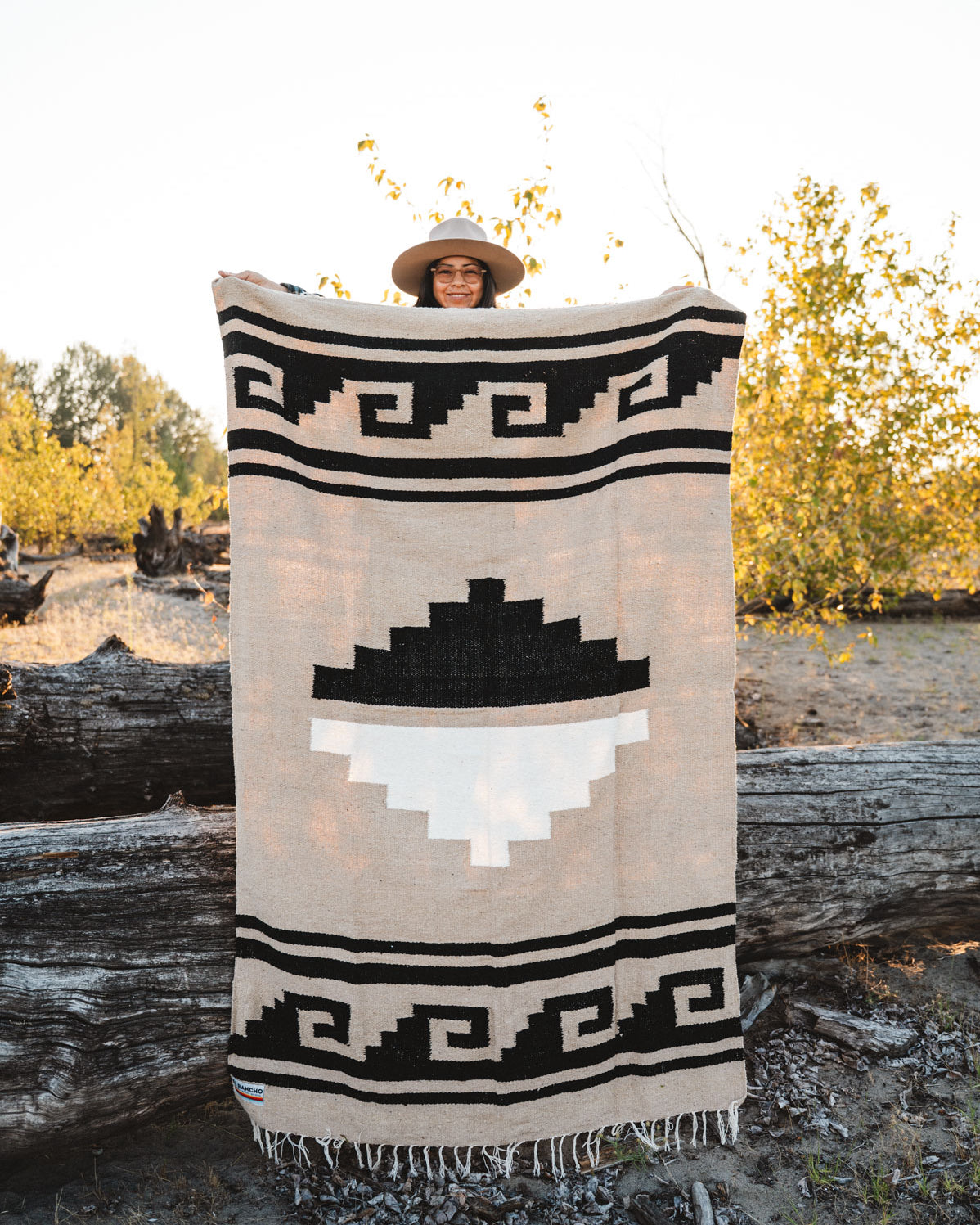 Greca Mixteca handwoven mexican blanket being held outside