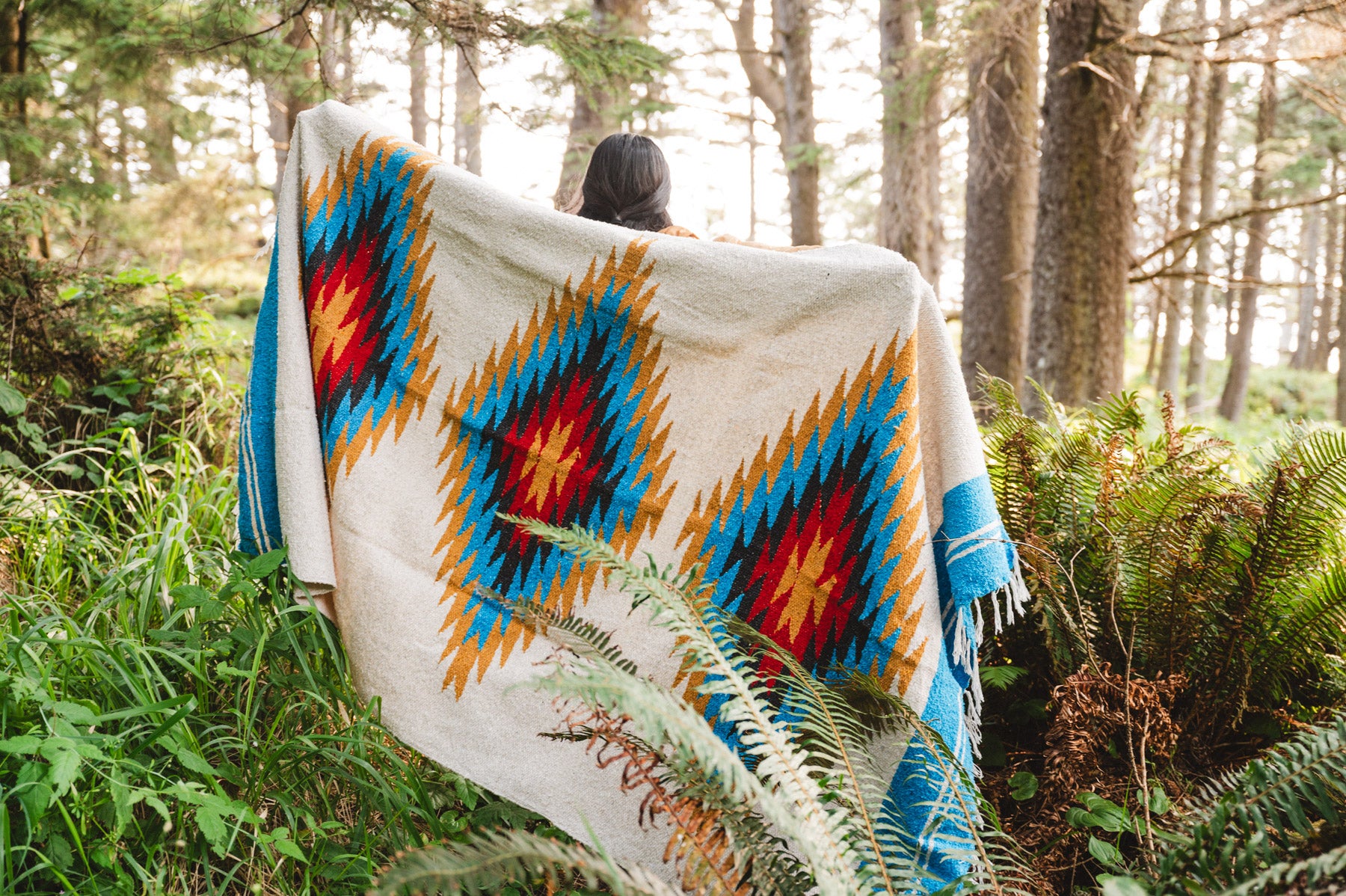 turquoise diamond mexican blanket among the ferns