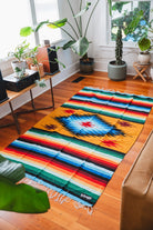 rainbow diamond blanket on the floor