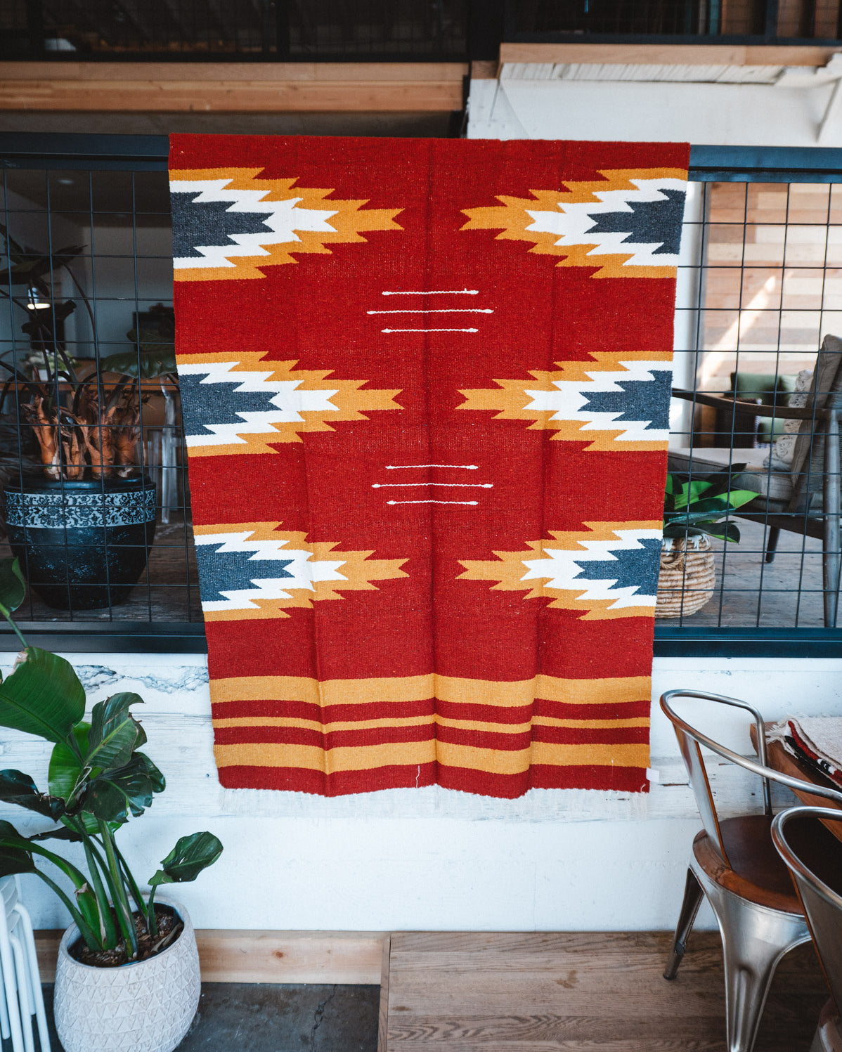 Handwoven Mexican Blanket Relampago pattern in modern industrial setting