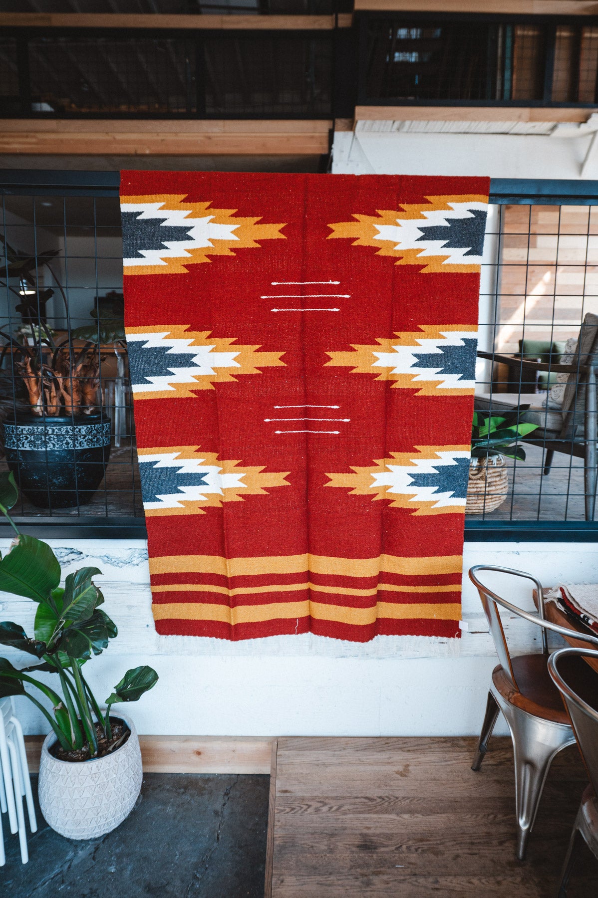 Handwoven Mexican Blanket Relampago pattern in modern industrial setting