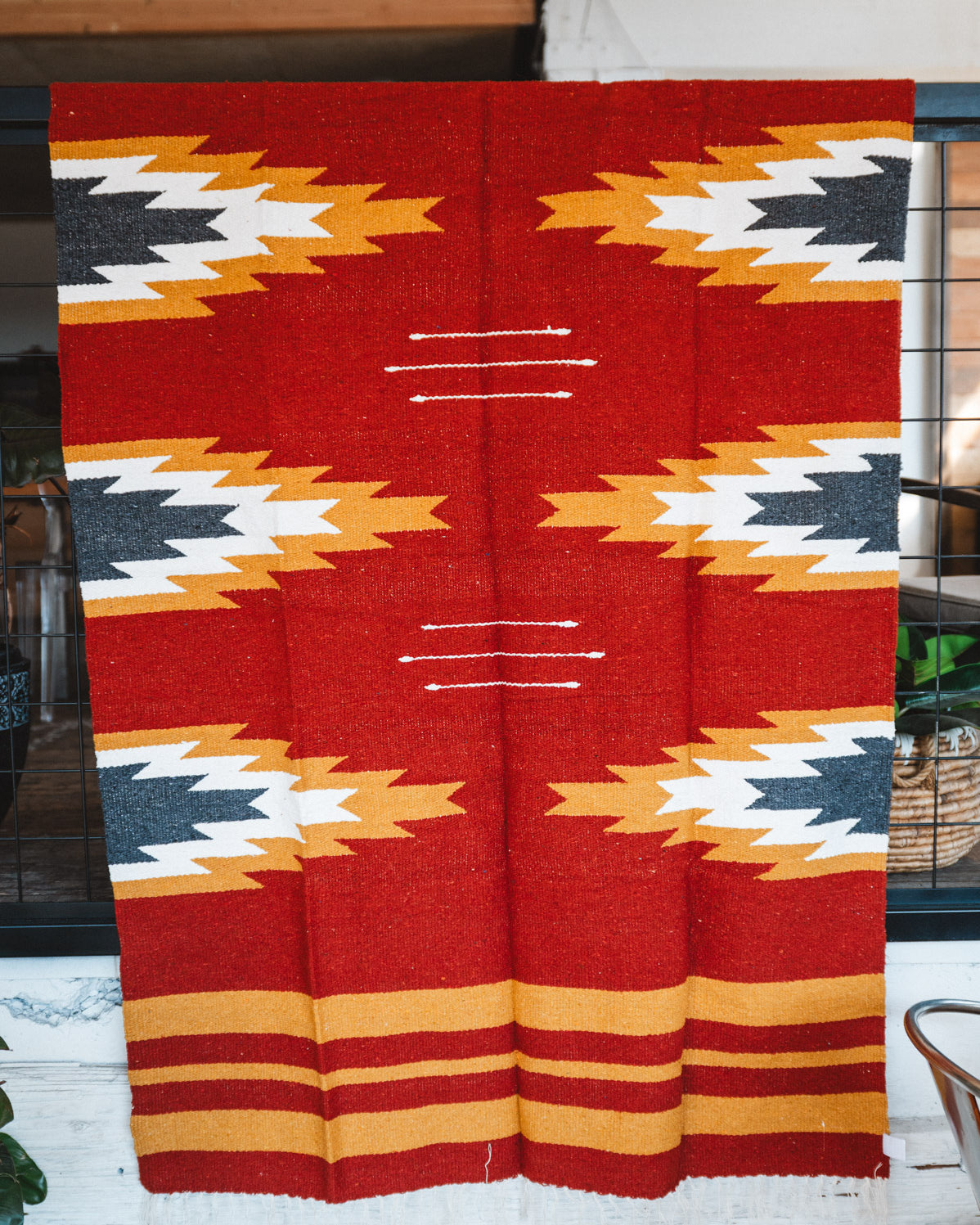 Handwoven Mexican Blanket Relampago pattern in modern industrial setting