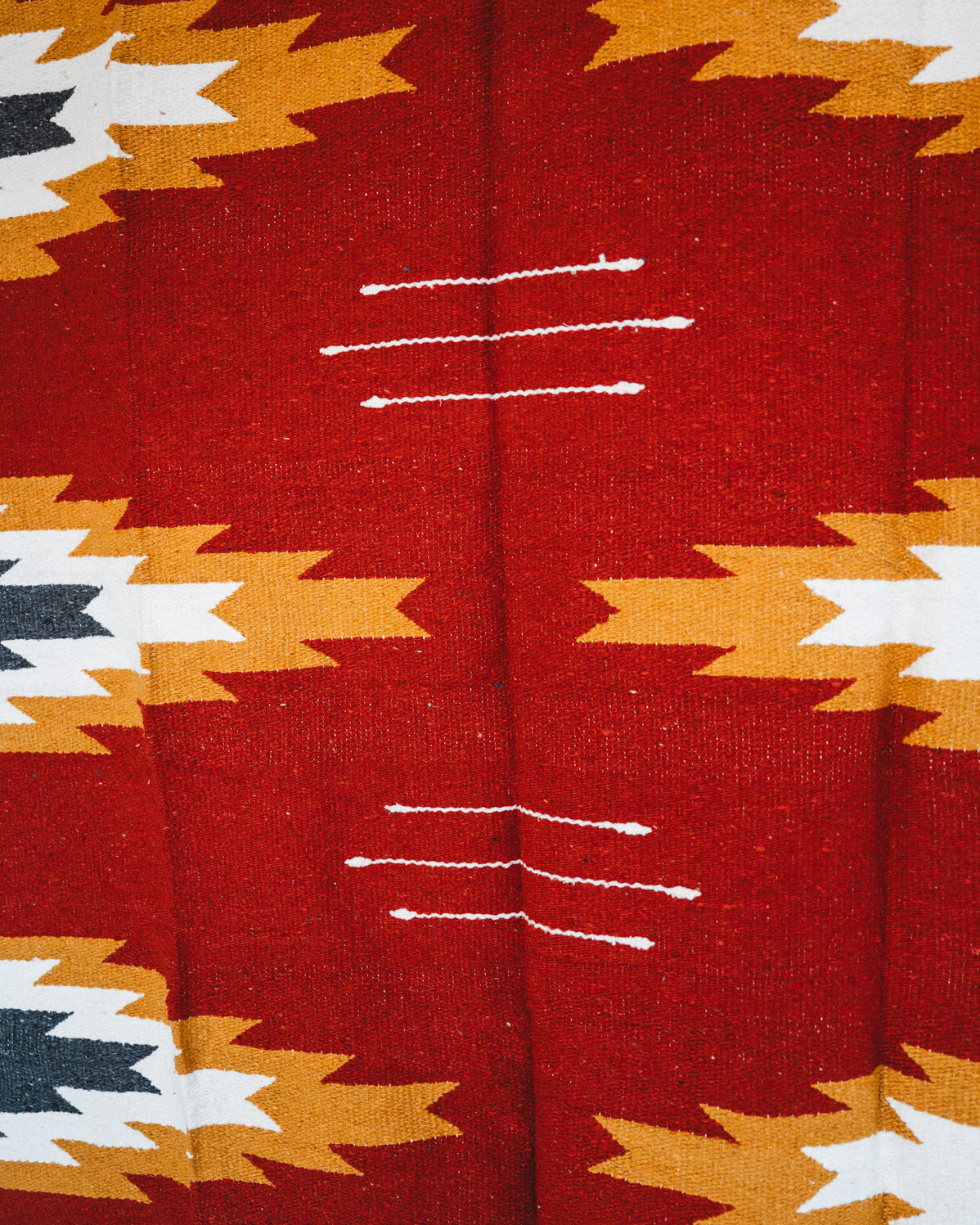 Handwoven Mexican Blanket Relampago pattern in modern industrial setting