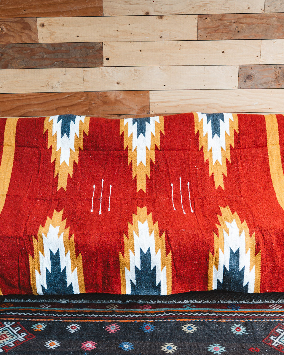Handwoven Mexican Blanket Relampago pattern in modern industrial setting