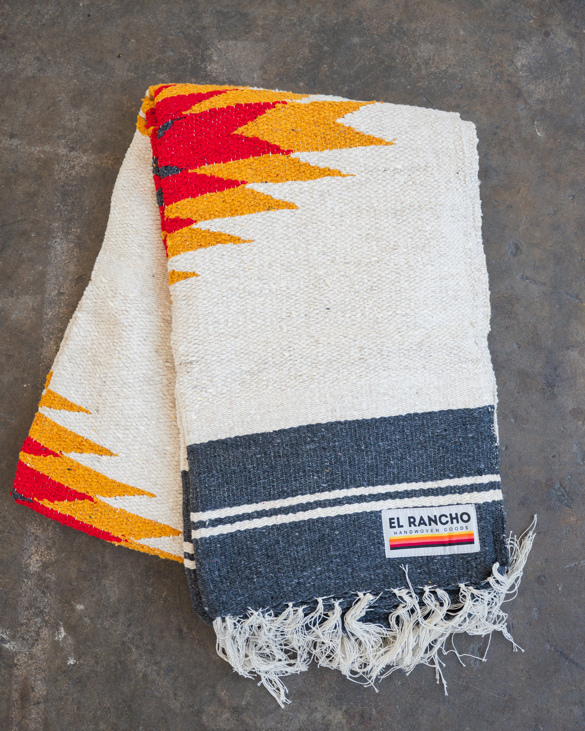 red yellow and black southwestern handwoven blanket folded