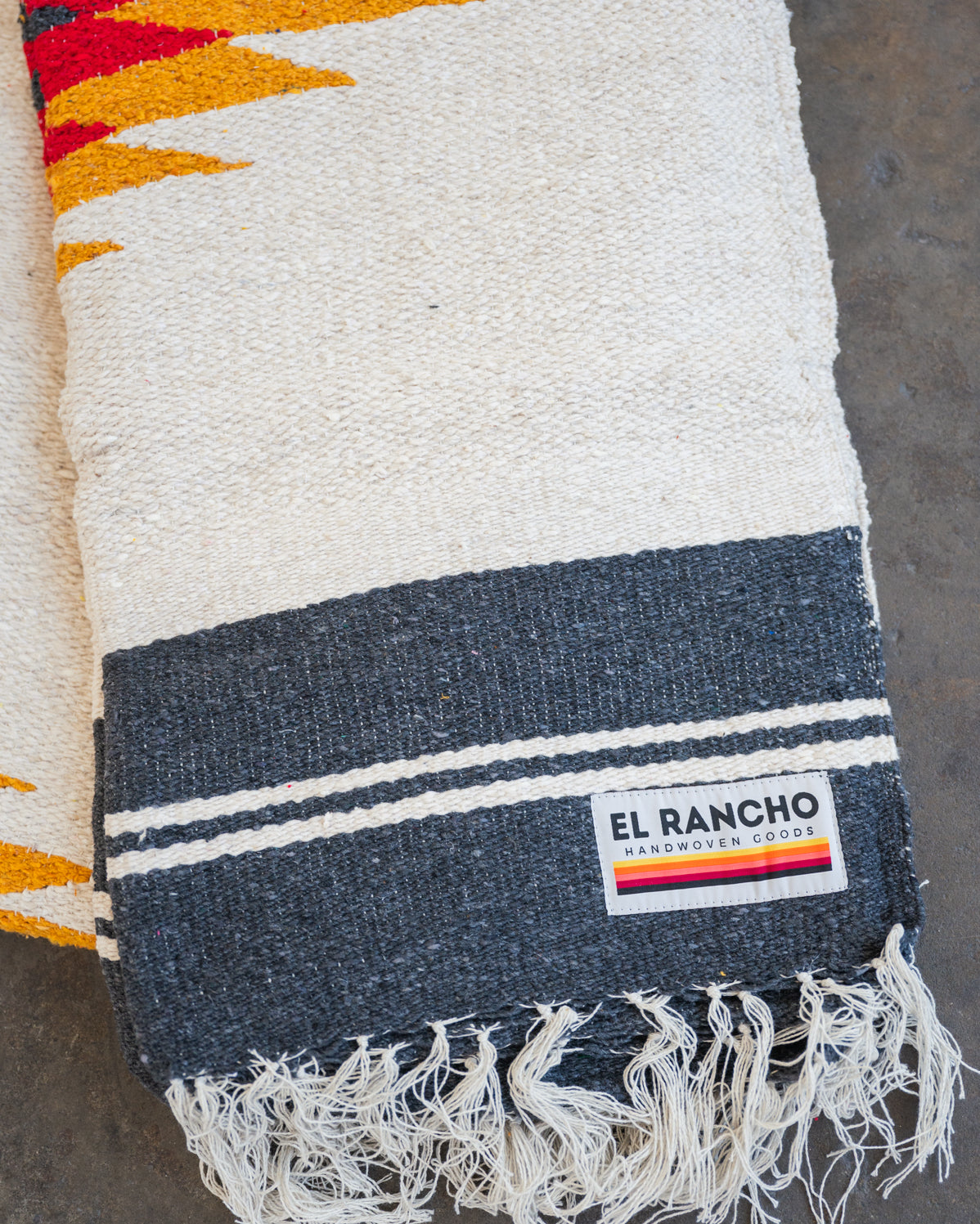 red yellow and black southwestern handwoven blanket folded