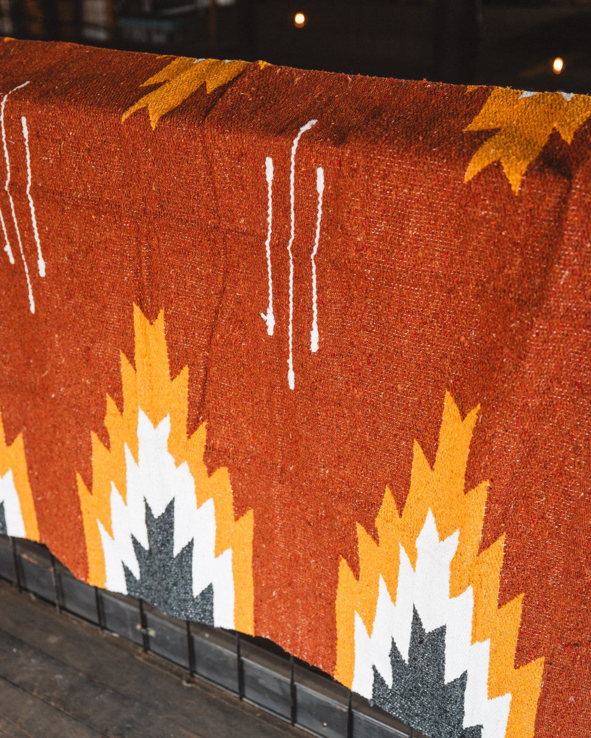 Textile with geometric pattern on a wooden surface