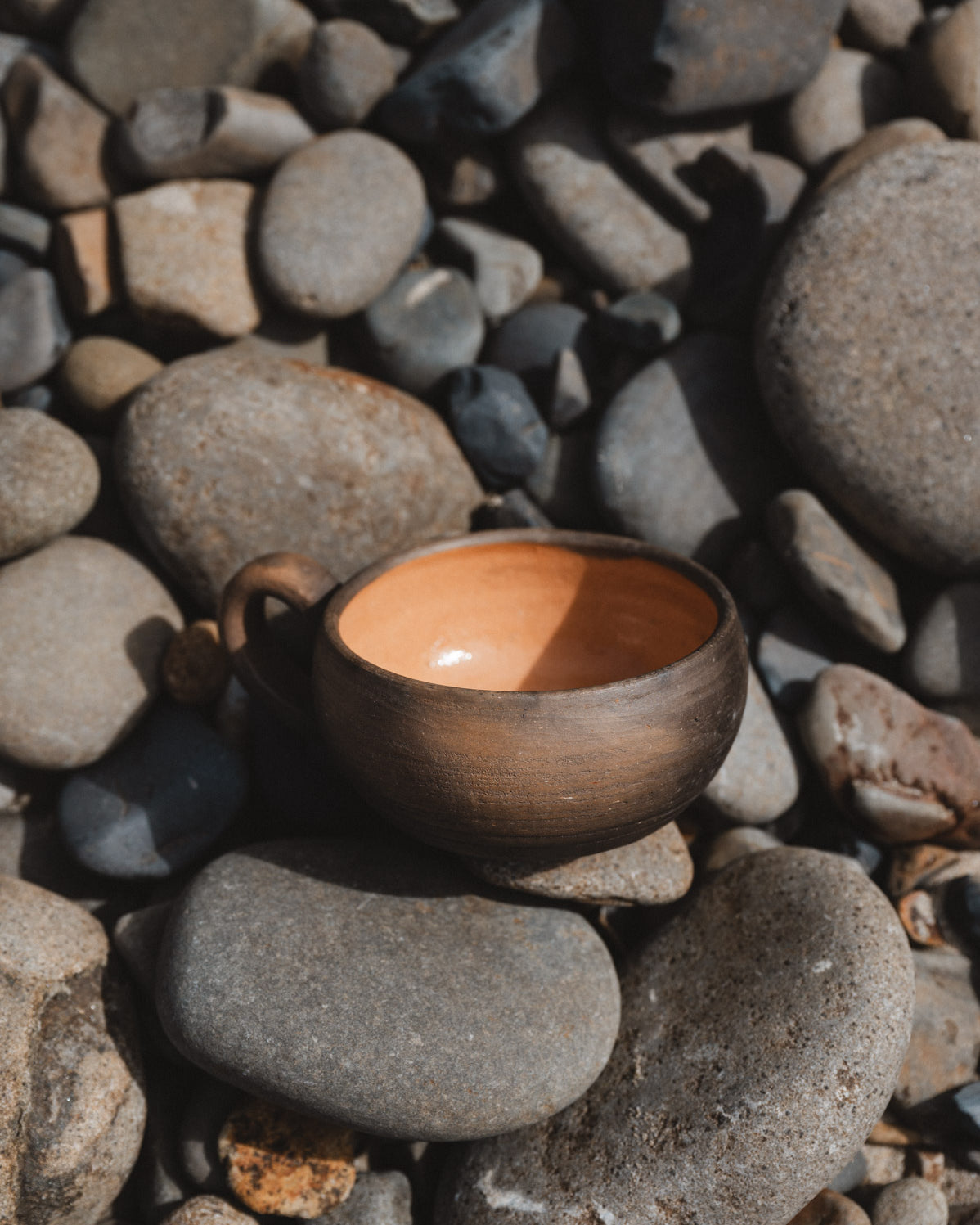 rustic oaxacan coffee cup on rocks