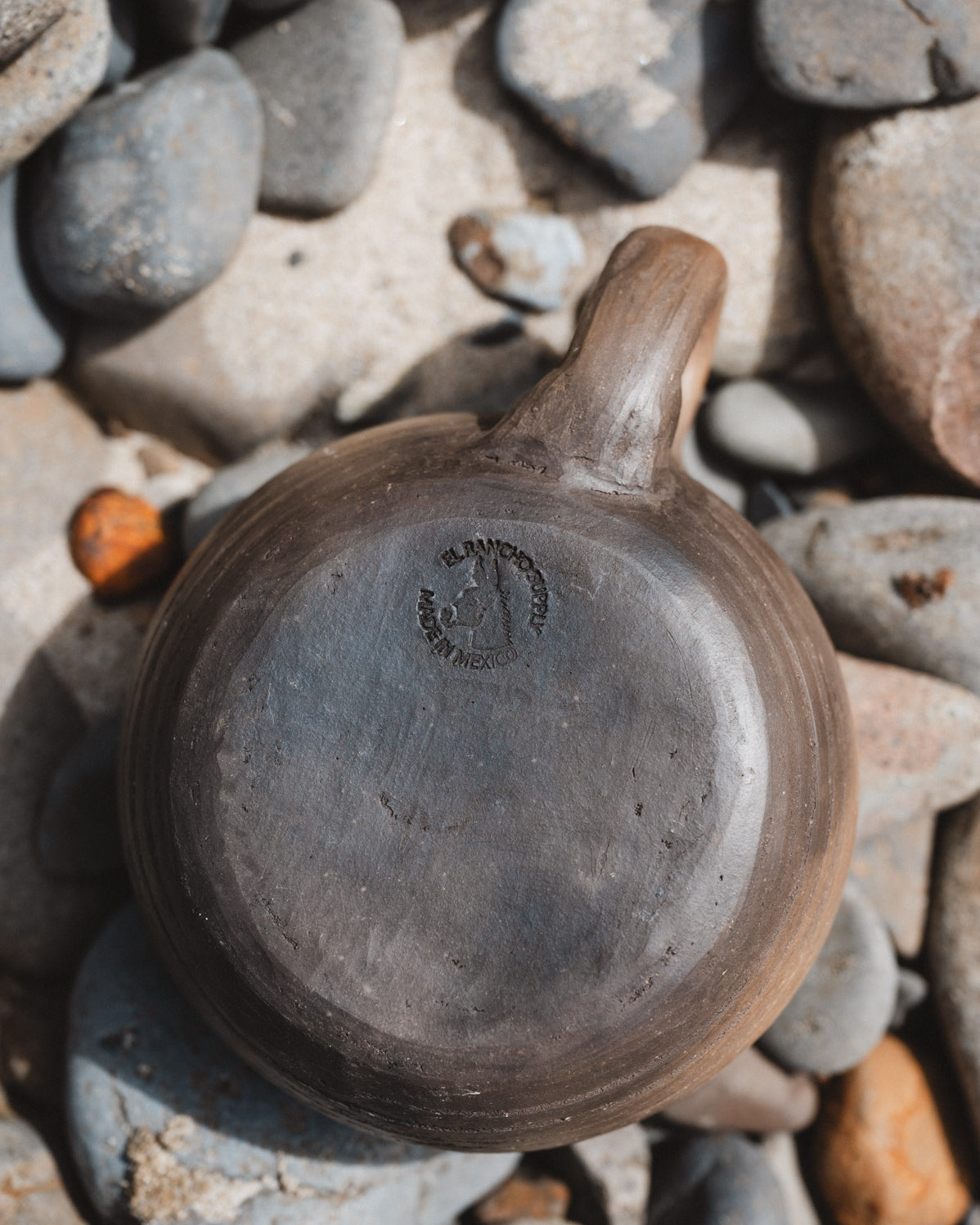 rustic oaxacan coffee mug on rocks