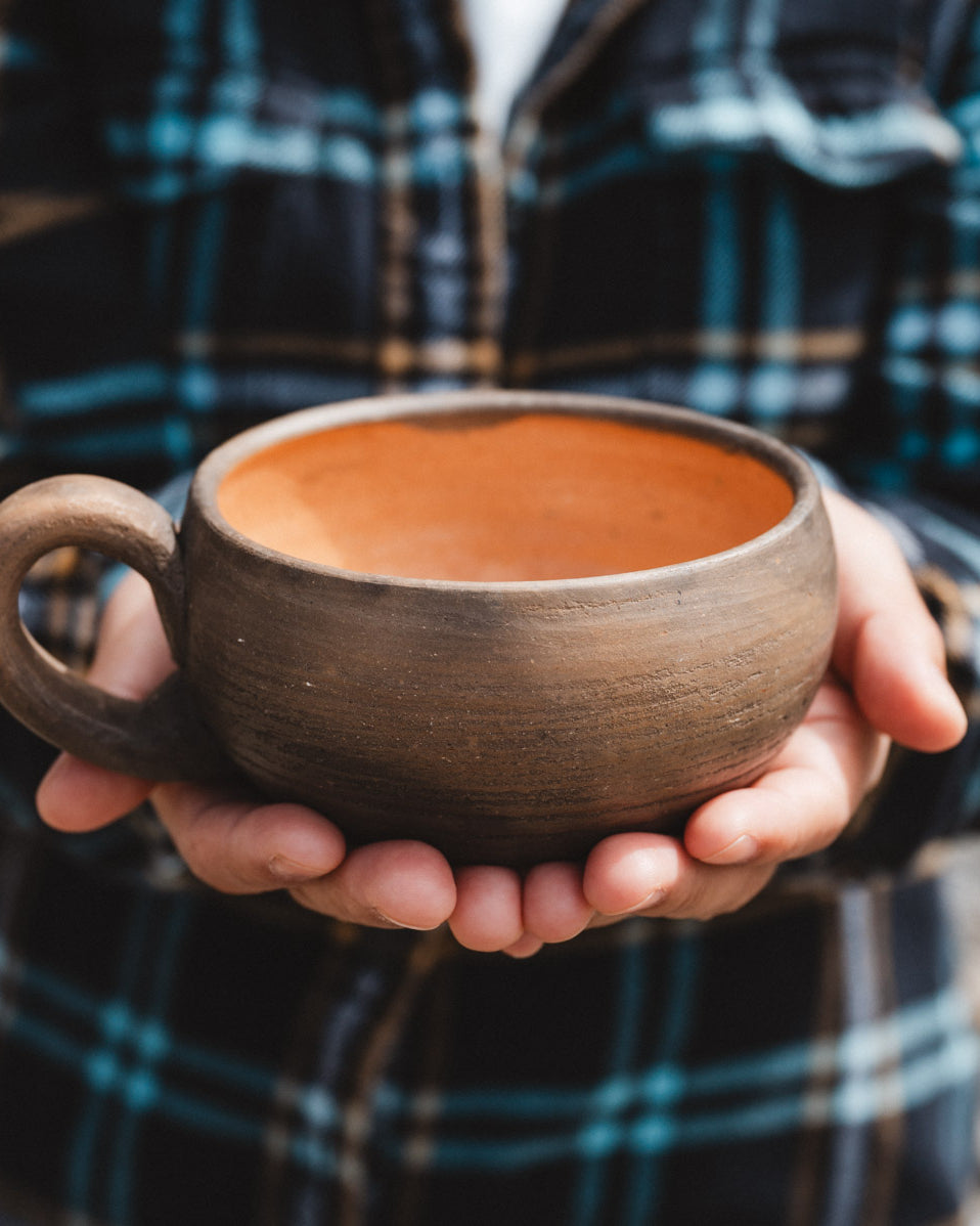 Oaxacan coffee cup held in hands