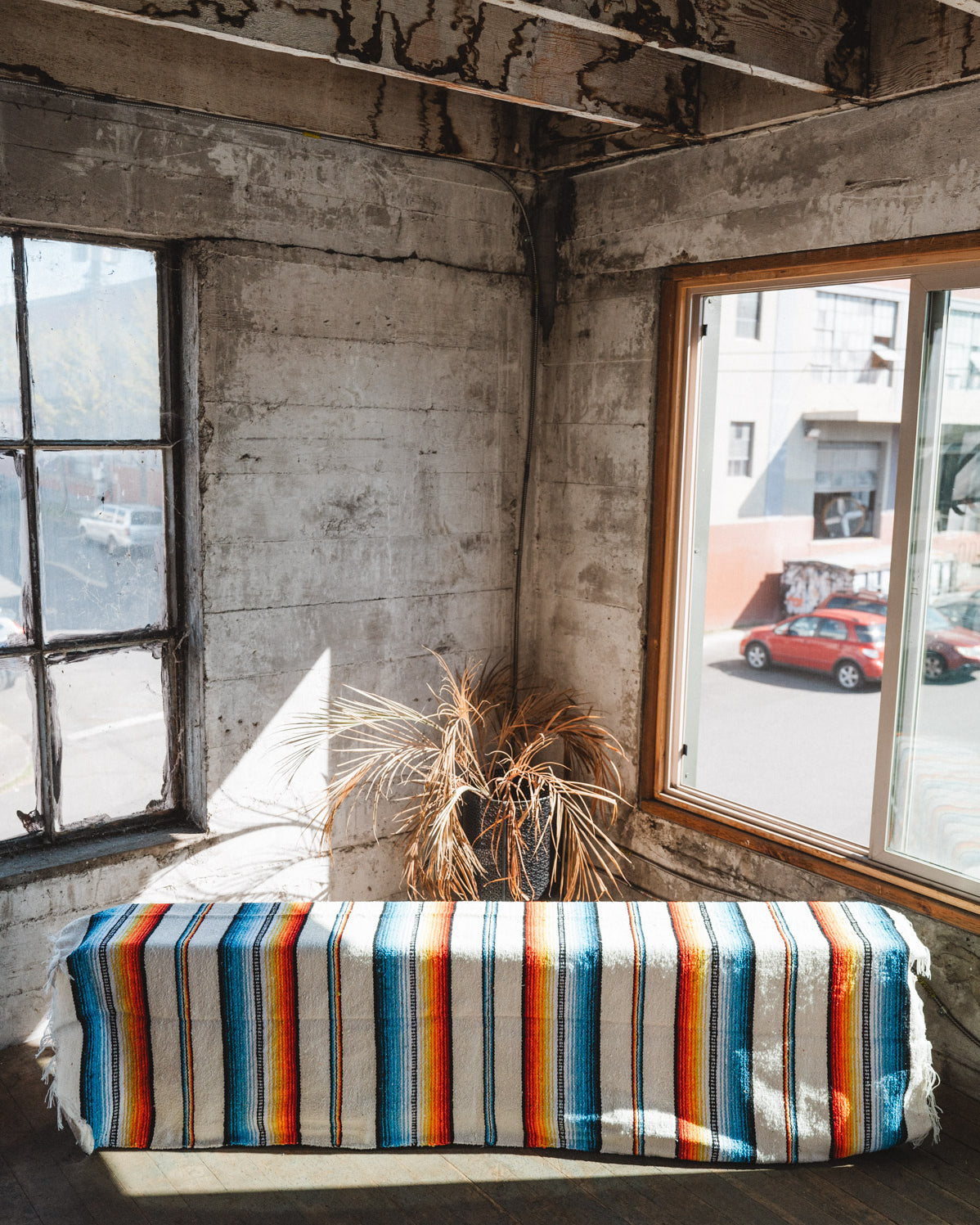 Socal Saltillo handwoven Blanket hanging in a urban loft