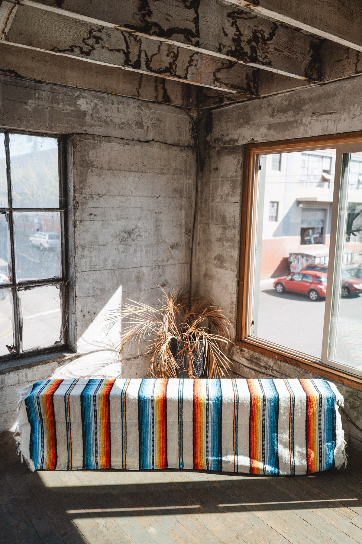 Socal Saltillo handwoven Blanket hanging in a urban loft