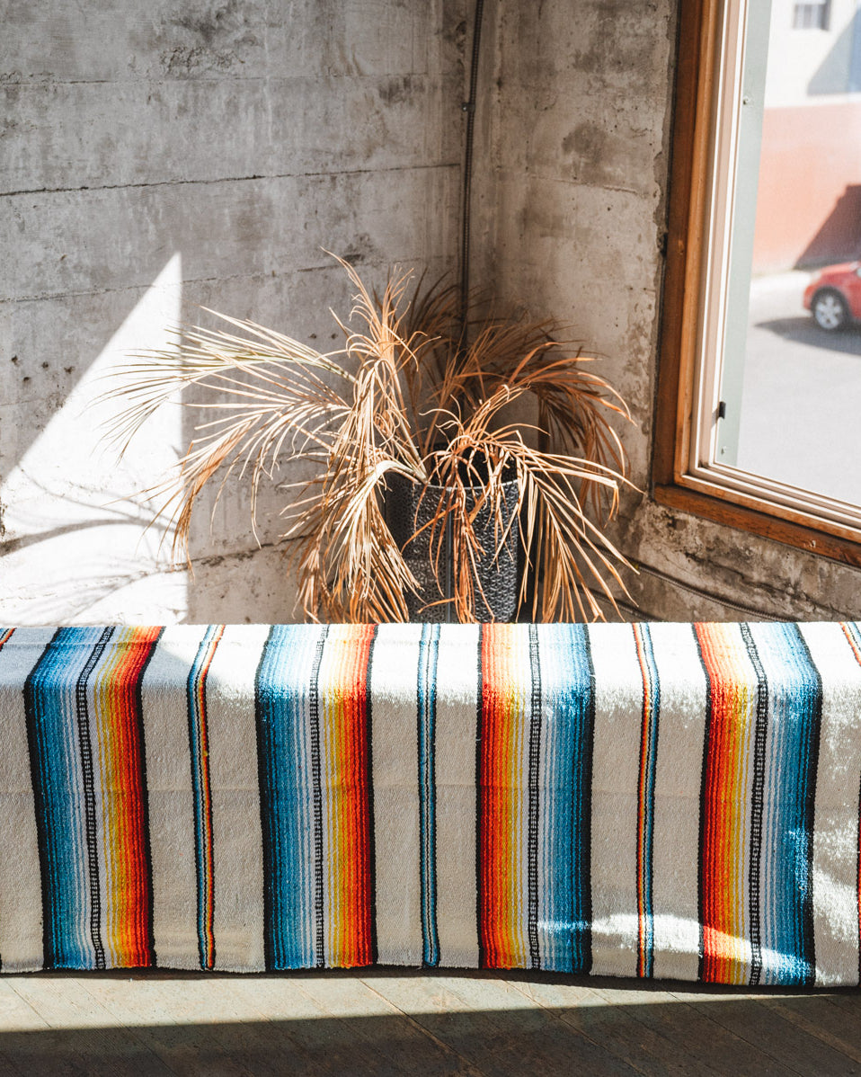 Socal Saltillo handwoven Blanket hanging in a urban loft
