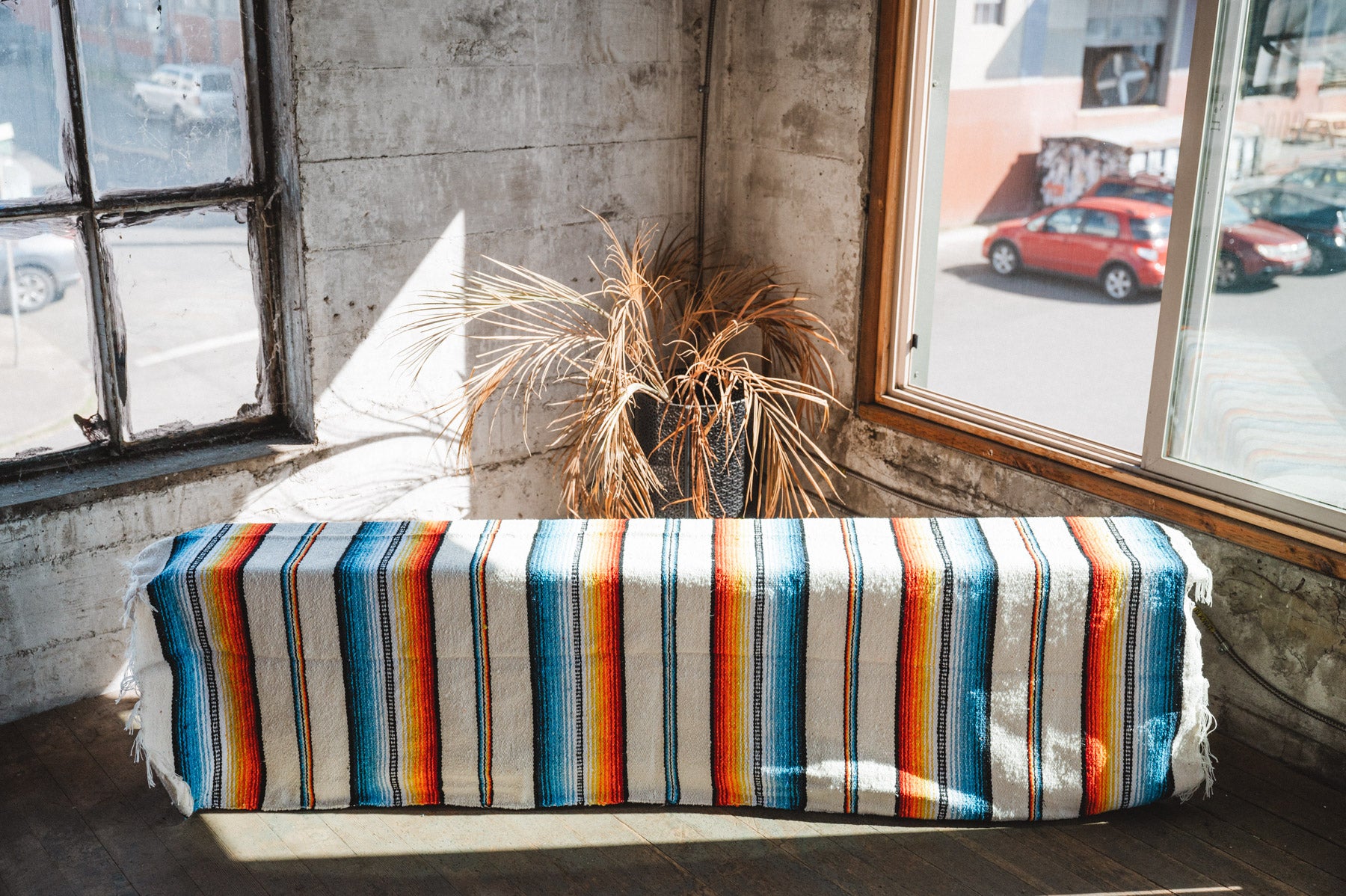 Socal Saltillo handwoven Blanket hanging in a urban loft