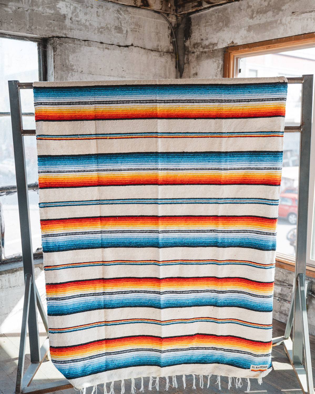 Socal Saltillo handwoven Blanket hanging in a urban loft