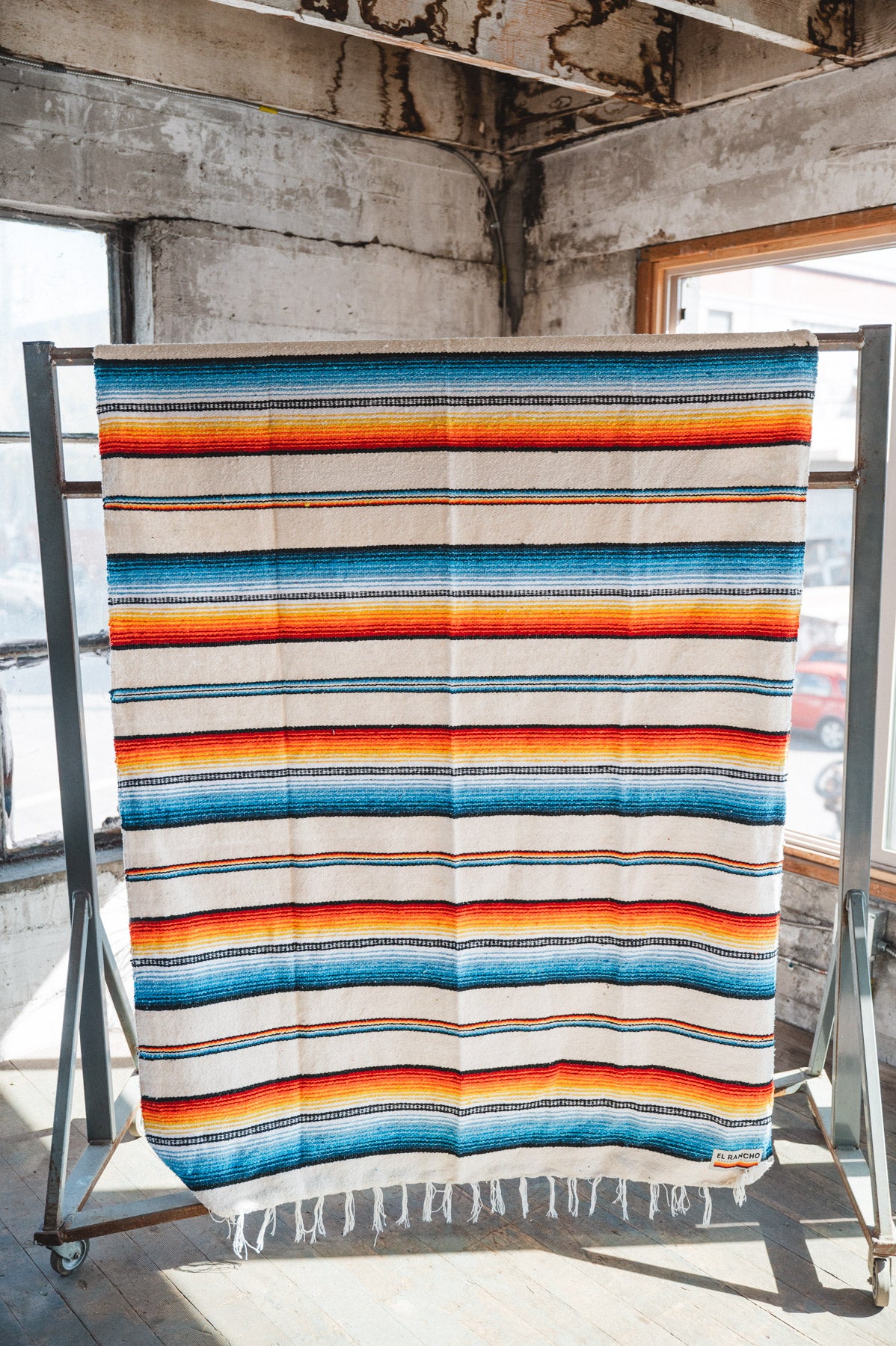 Socal Saltillo handwoven Blanket hanging in a urban loft