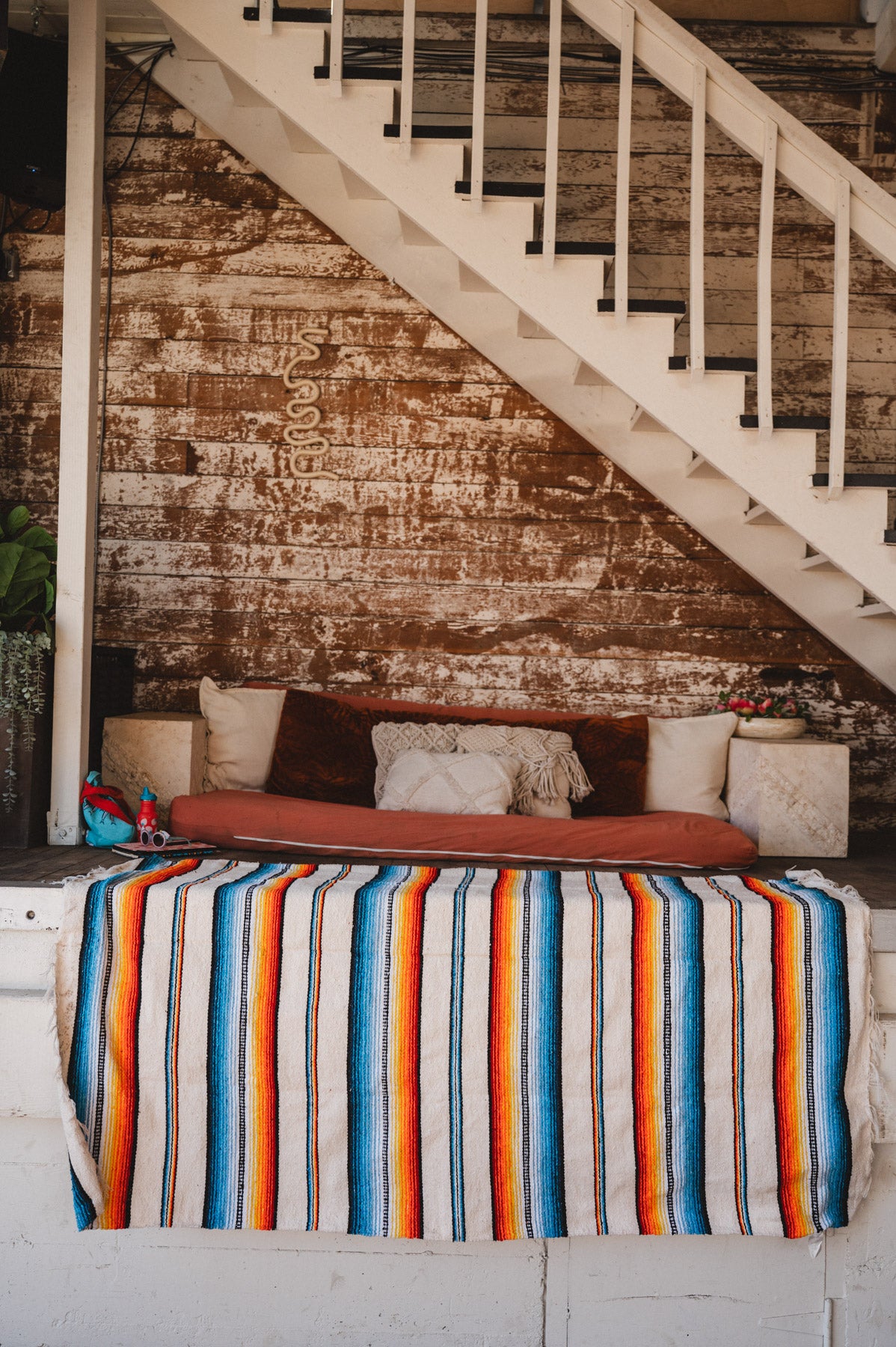 Socal Saltillo handwoven Blanket hanging in a urban loft
