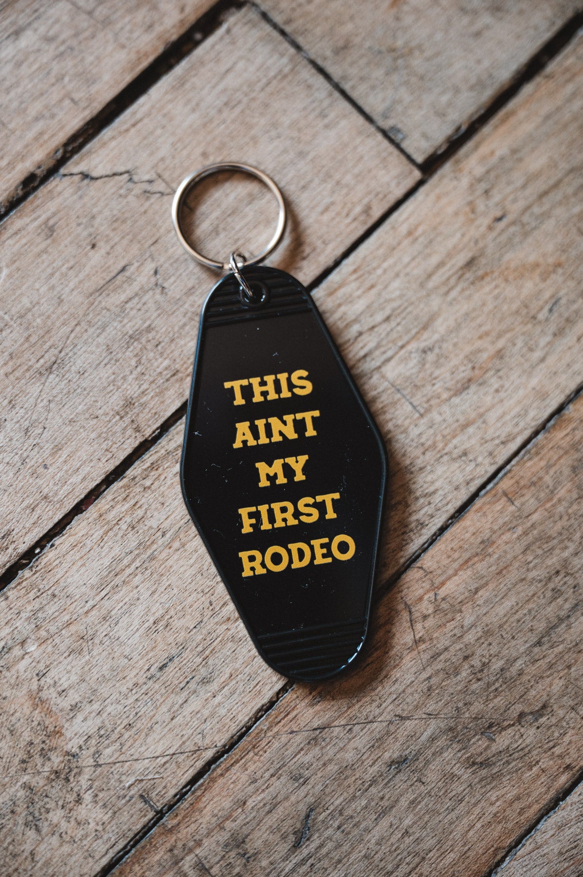 Retro Motel Keychain on wooden Floor