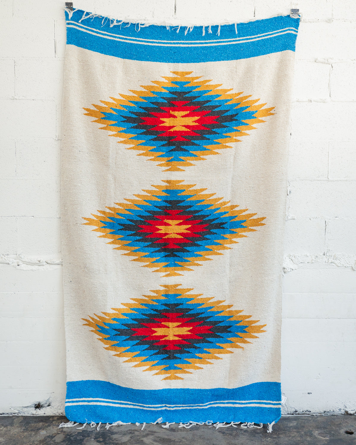 Red and yellow and blue southwestern diamond handwoven blanket