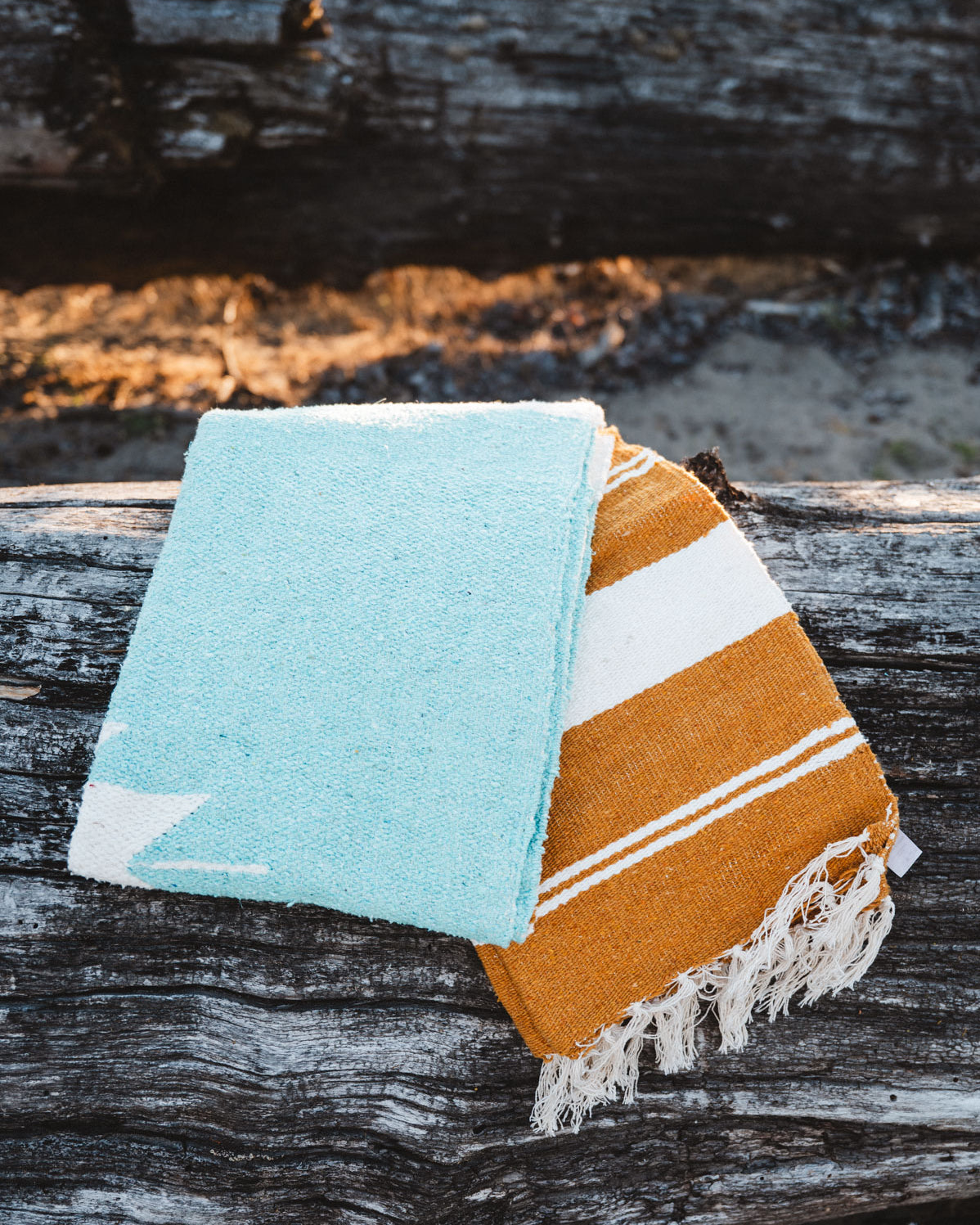 Folded turquoise mexican blanket
