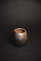 Oaxacan Black Clay mezcal copita on black background