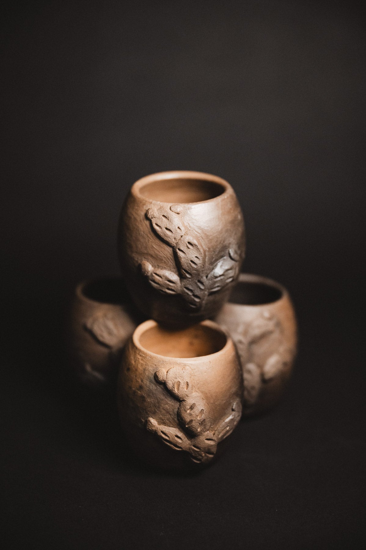 Oaxacan Black Clay mezcal copitas on black background