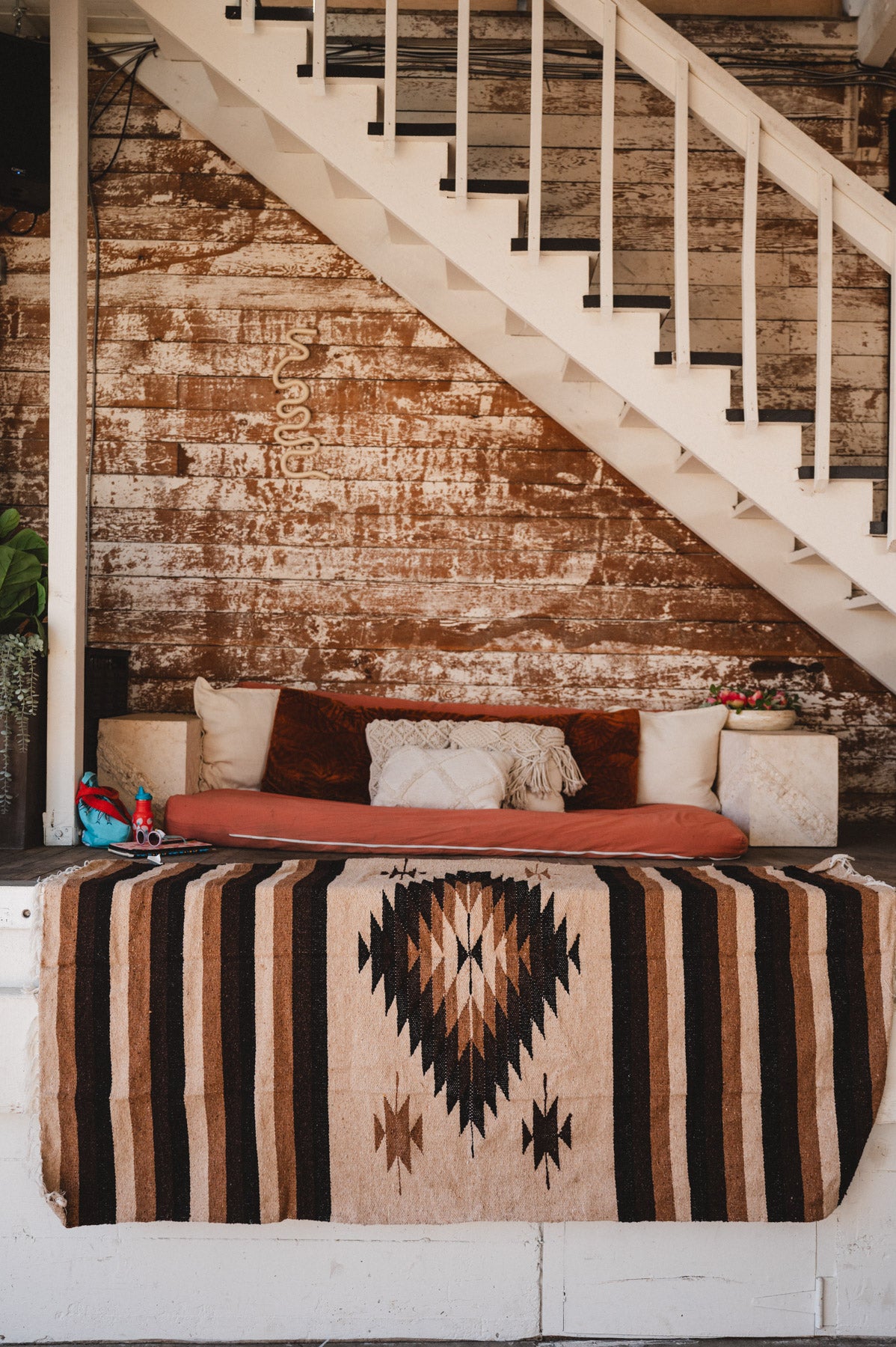 Brown beige and neutral colored handwoven Mexican blanket in urban loft setting