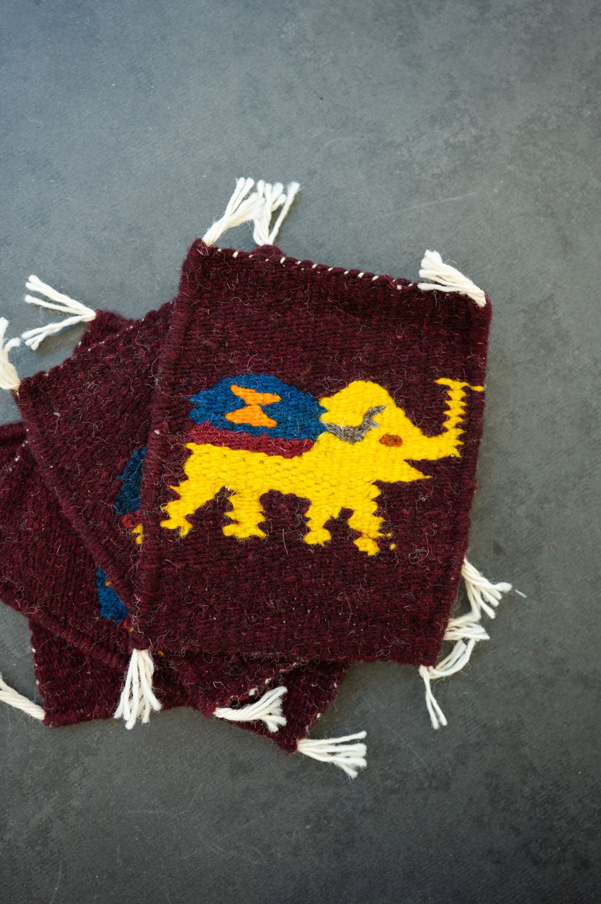 Handwoven wool coaster from Teotitlan Del Valle of an elephant